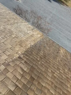 Half cleaned, same roof in Winchester VA by Thompson's Pressure Washing