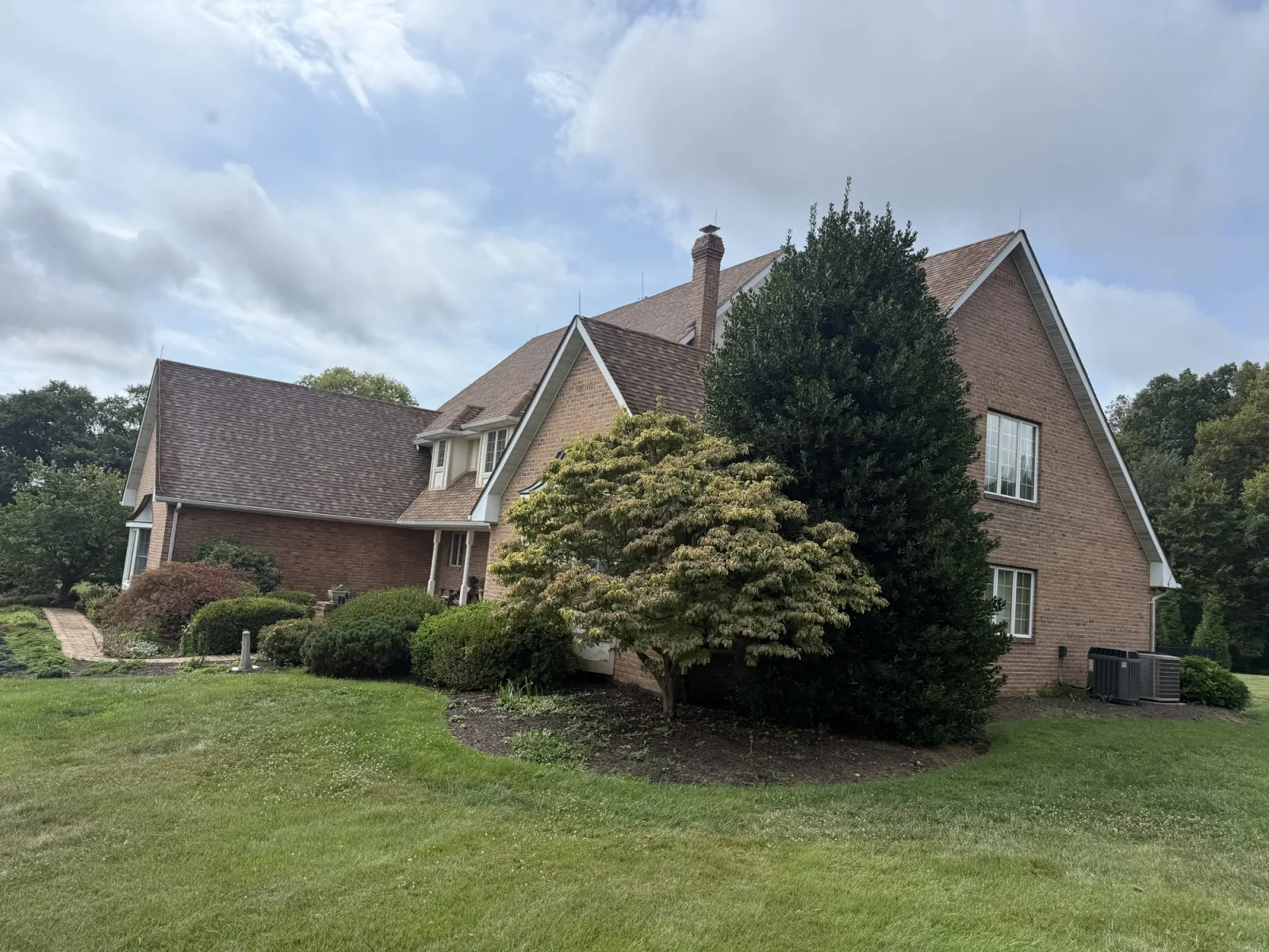 Shingle roof planes and dormers before rejuvenation in Martinsburg WV by Thompson's Pressure Washing