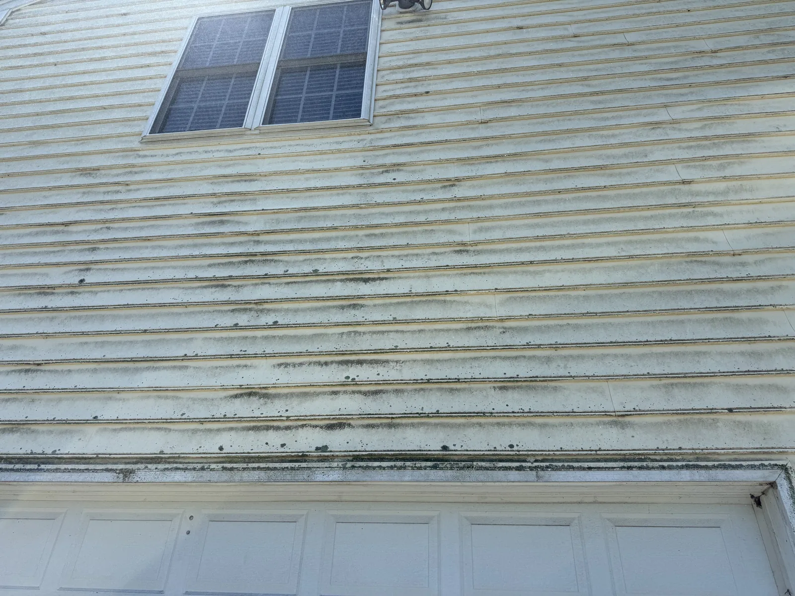 Streaked vinyl siding, before in Winchester VA by Thompson's Pressure Washing